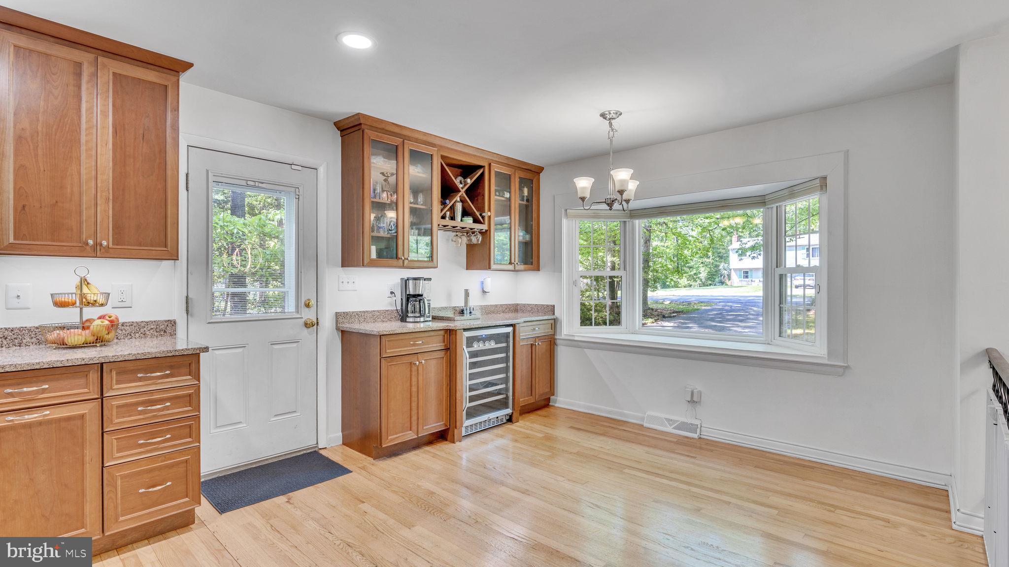 24680 Morgan Road Hollywood, MD 20636 - Photo 10 of 34 a kitchen with a window wooden floor and stainless steel appliances