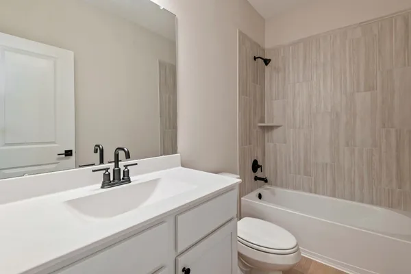 a view of hallway with wooden floor
