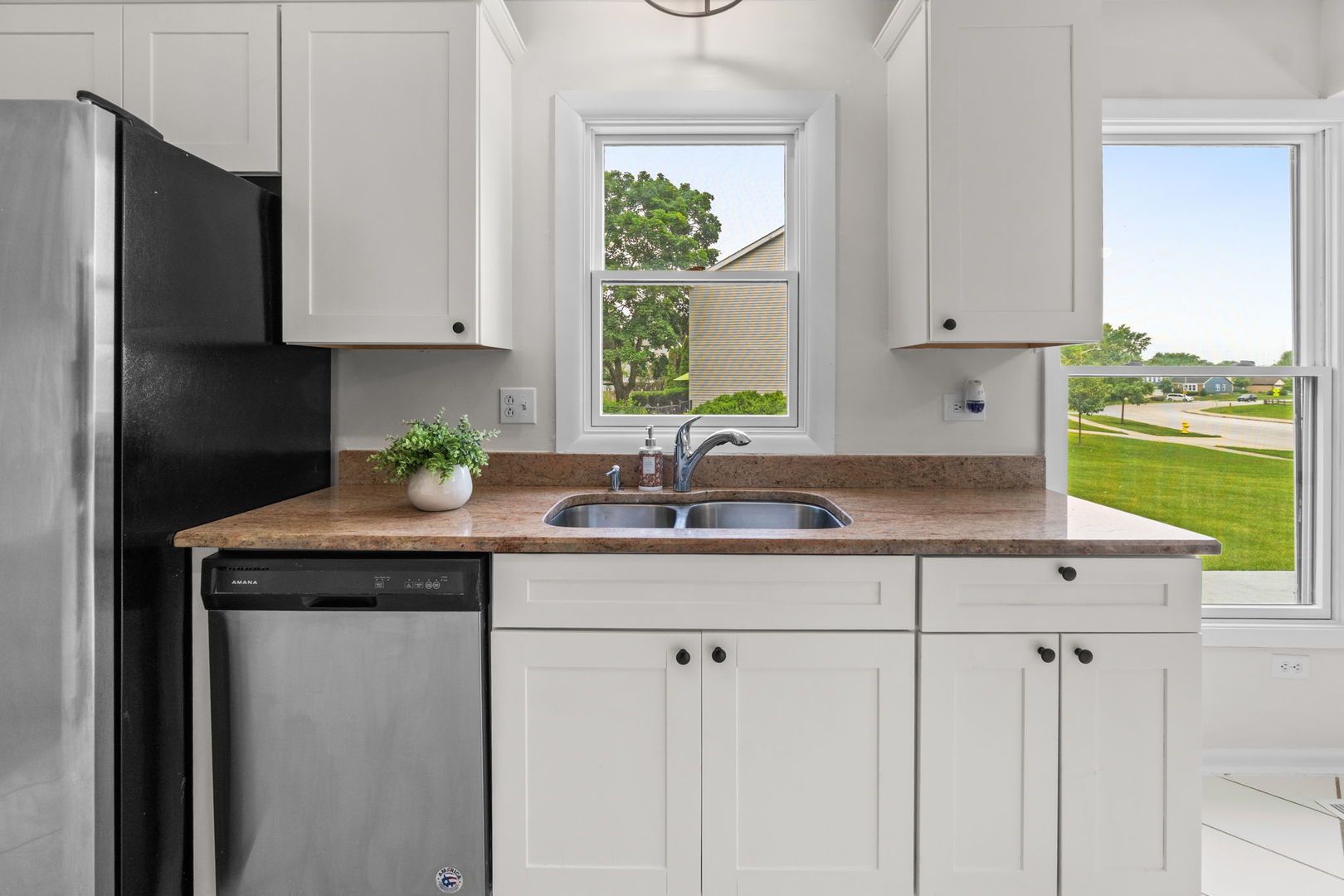2254 Blacksmith Drive Wheaton, IL 60189 - Photo 11 of 32 a kitchen with stainless steel appliances granite countertop a sink and a white cabinets