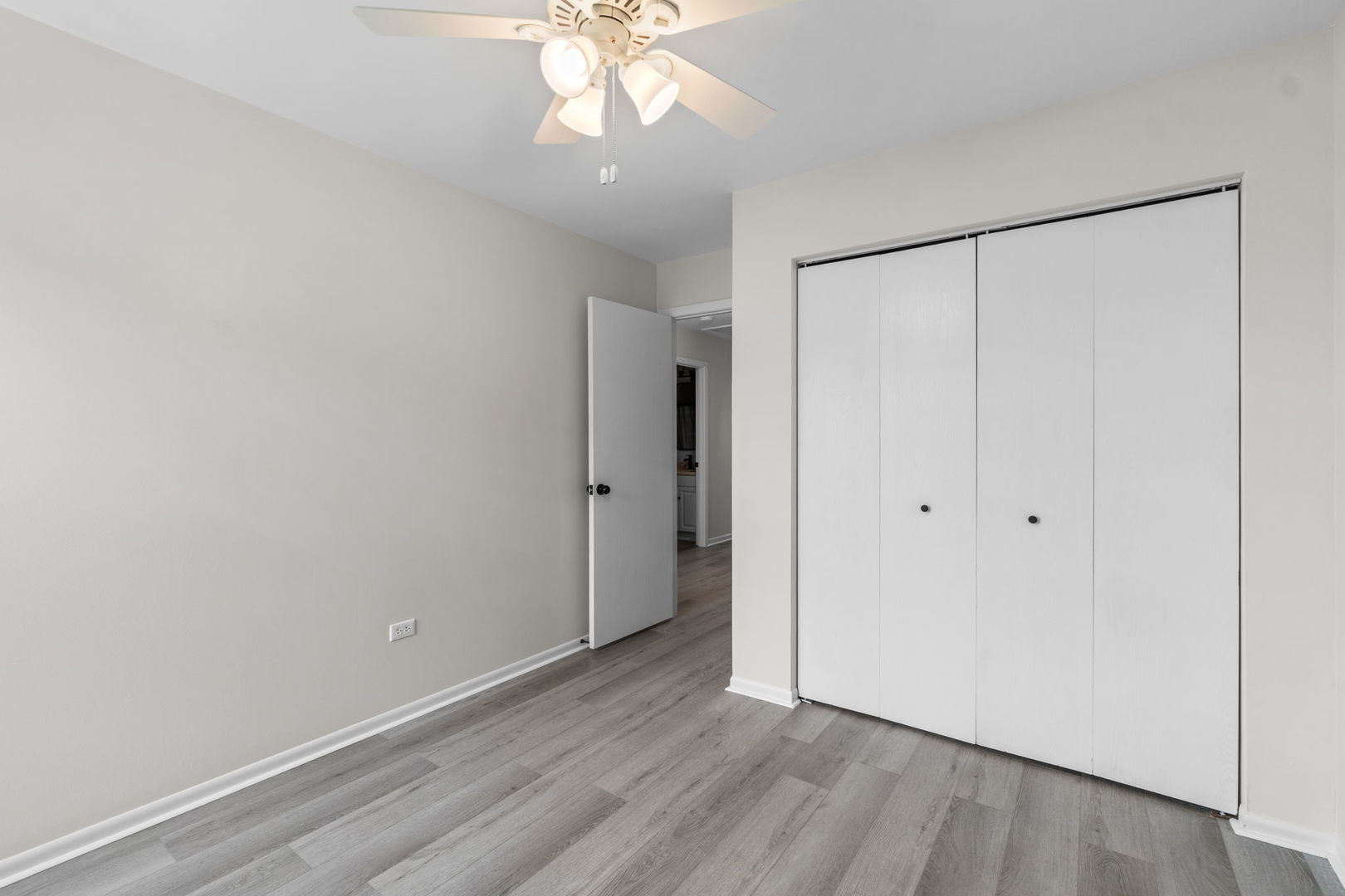 2254 Blacksmith Drive Wheaton, IL 60189 - Photo 20 of 32 a view of an empty room with wooden floor
