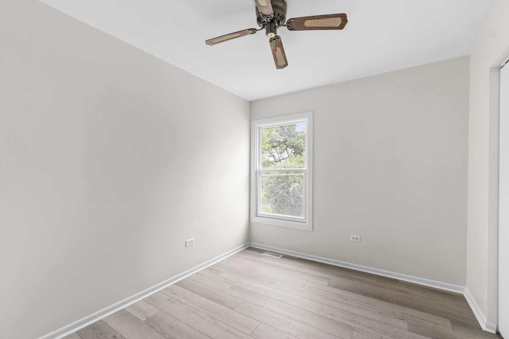 2254 Blacksmith Drive Wheaton, IL 60189 - Photo 21 of 32 an empty room with windows and fan