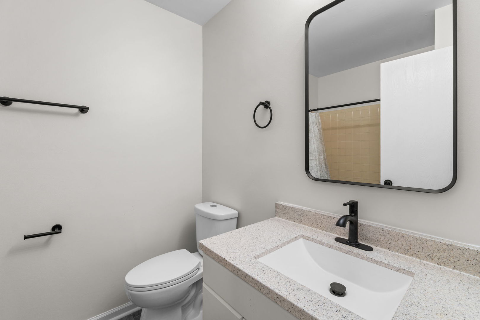 2254 Blacksmith Drive Wheaton, IL 60189 - Photo 23 of 32 a bathroom with a sink toilet and mirror