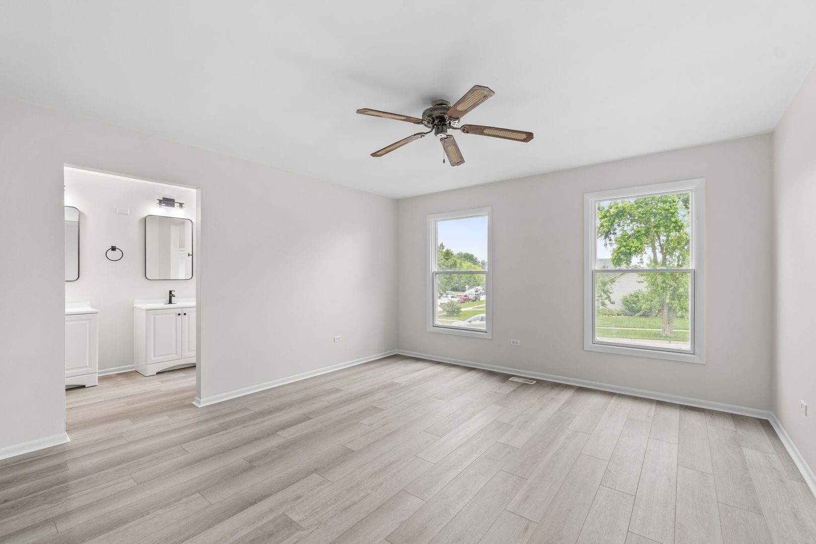 2254 Blacksmith Drive Wheaton, IL 60189 - Photo 26 of 32 a view of empty room with wooden floor and fan