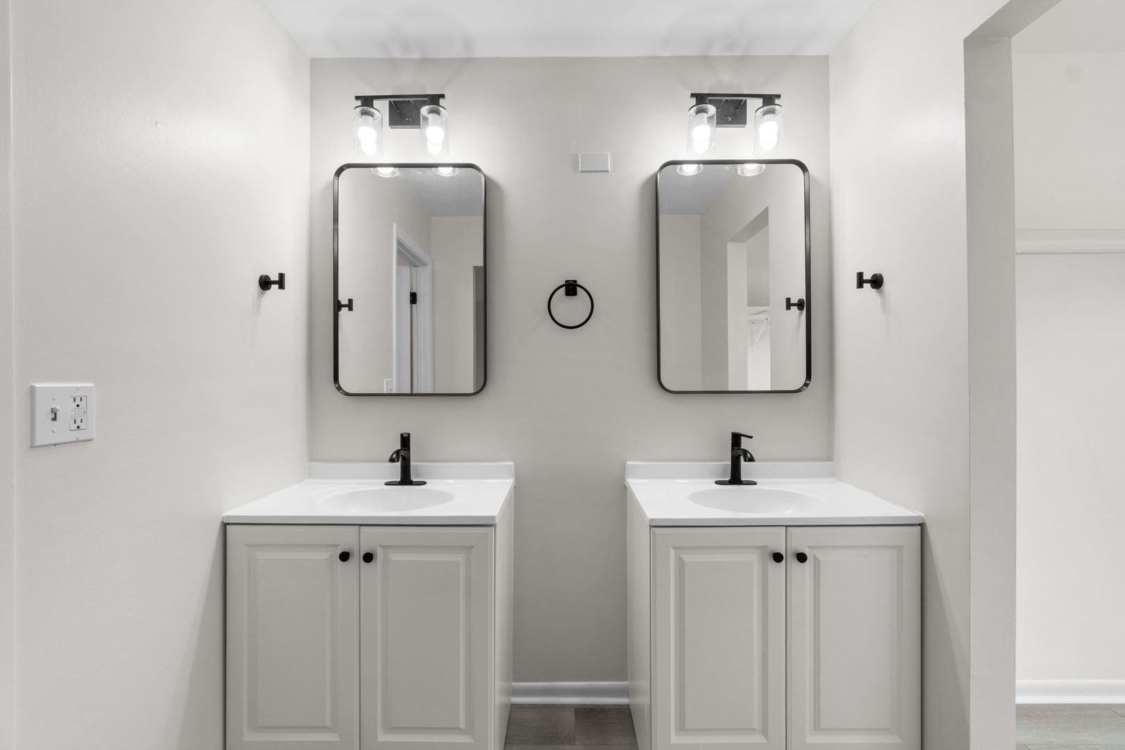2254 Blacksmith Drive Wheaton, IL 60189 - Photo 28 of 32 a bathroom with double vanity sinks and two mirror