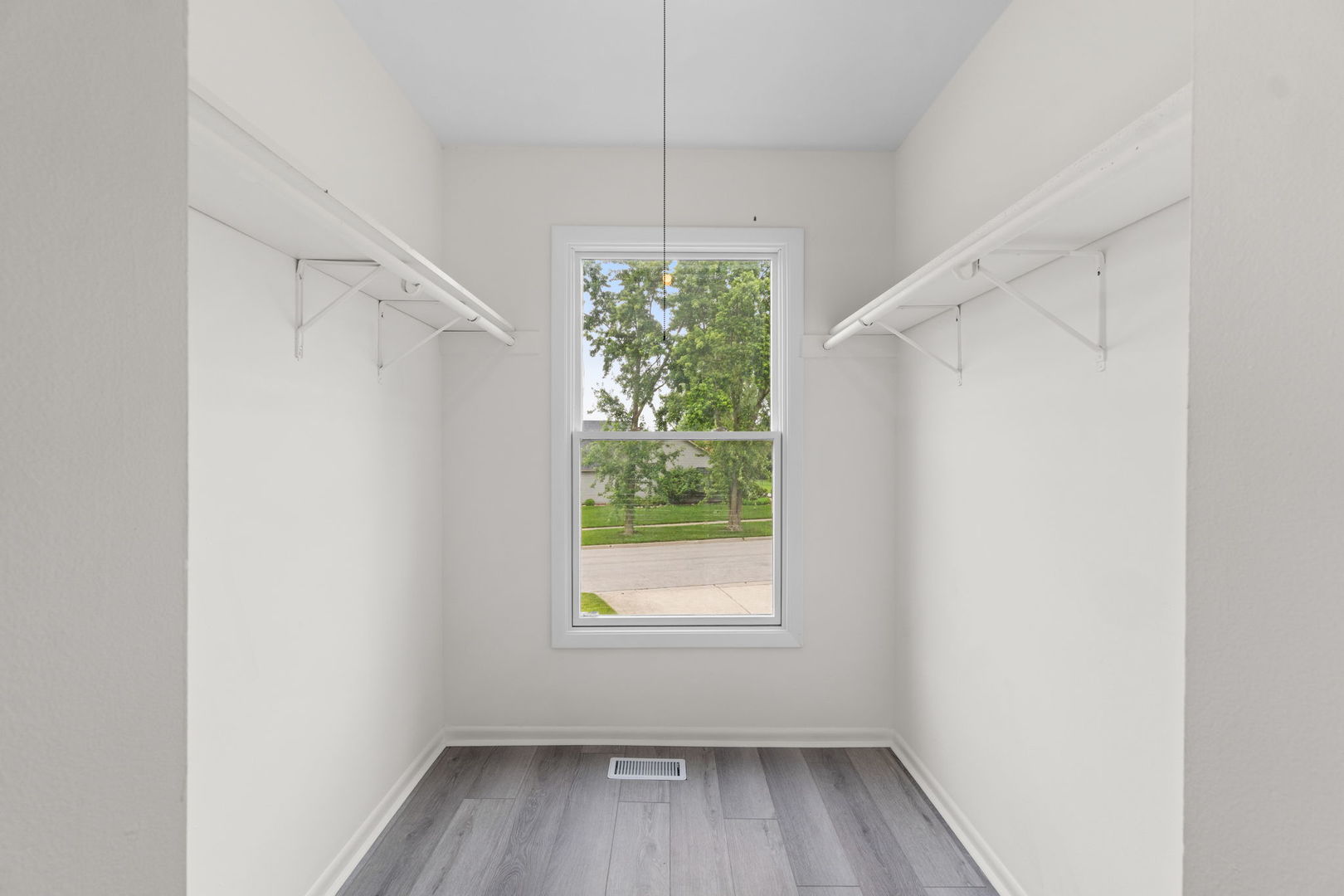 2254 Blacksmith Drive Wheaton, IL 60189 - Photo 30 of 32 a view of a room with window wooden floor and front door