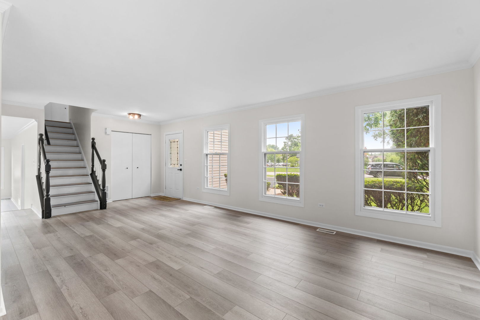 2254 Blacksmith Drive Wheaton, IL 60189 - Photo 4 of 32 an empty room with wooden floor and windows