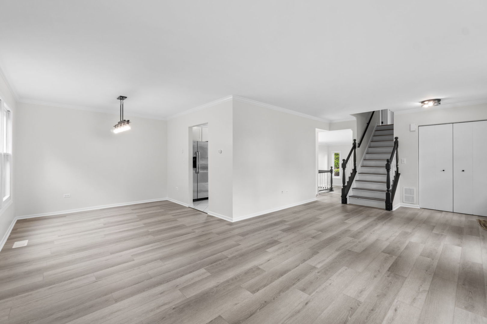 2254 Blacksmith Drive Wheaton, IL 60189 - Photo 5 of 32 an empty room with wooden floor and windows