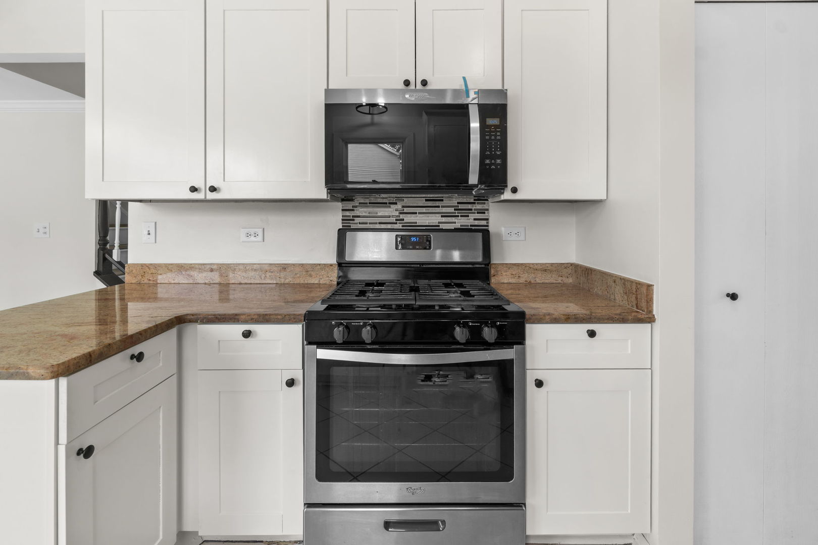 2254 Blacksmith Drive Wheaton, IL 60189 - Photo 10 of 32 a stove top oven sitting inside of a kitchen