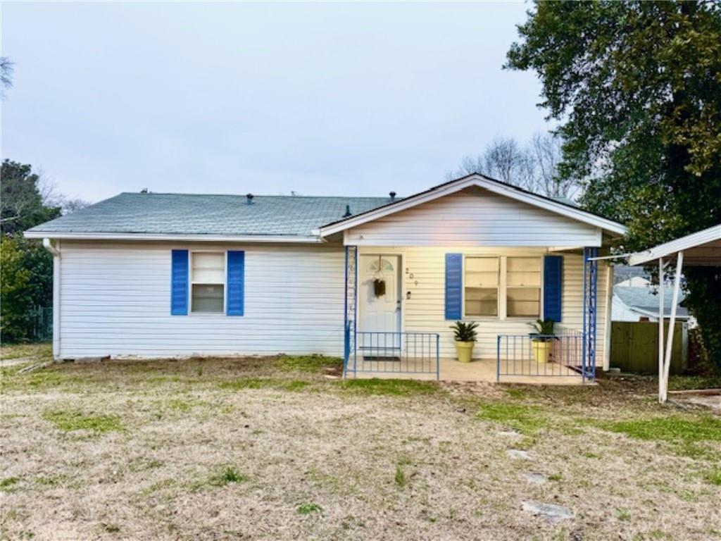 209 Moultrie Lane Southwest Rome, GA 30161 - Photo 1 of 46 a front view of a house with garden