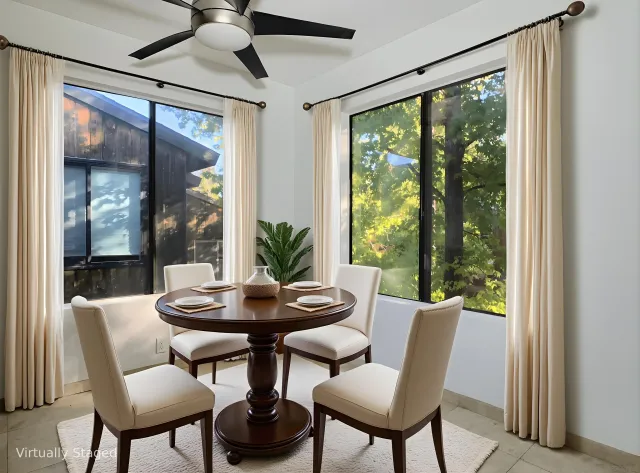 a view of a room that has a bed and a window in it