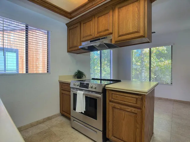 a view of cabinets a sink and dishwasher in a kitchen