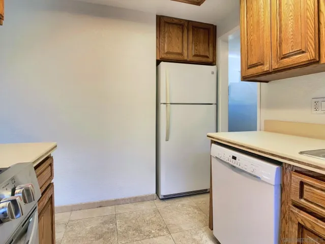 a spacious bathroom with a tub sink and mirror