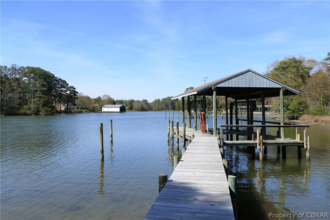 895 Holly Point Road Mathews, VA 23109 - Photo 6 of 47 a view of a lake with sitting area