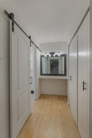 a bathroom with a tub shower and vanity