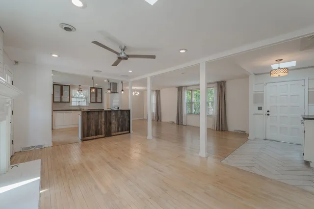a view of a kitchen with a sink and a window