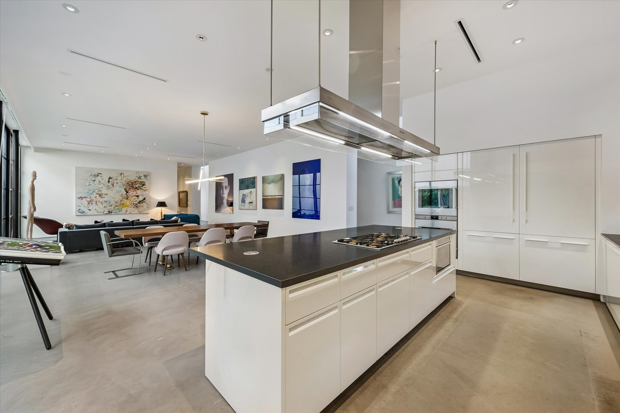 1527 Indiana Street Houston, TX 77006 - Photo 13 of 30 Kitchen features Poliform cabinetry throughout, blending refined Italian craftsmanship with sleek contemporary design. Side by side Gaggenau refrigerator, freezer paneled by matching Poliform panels.