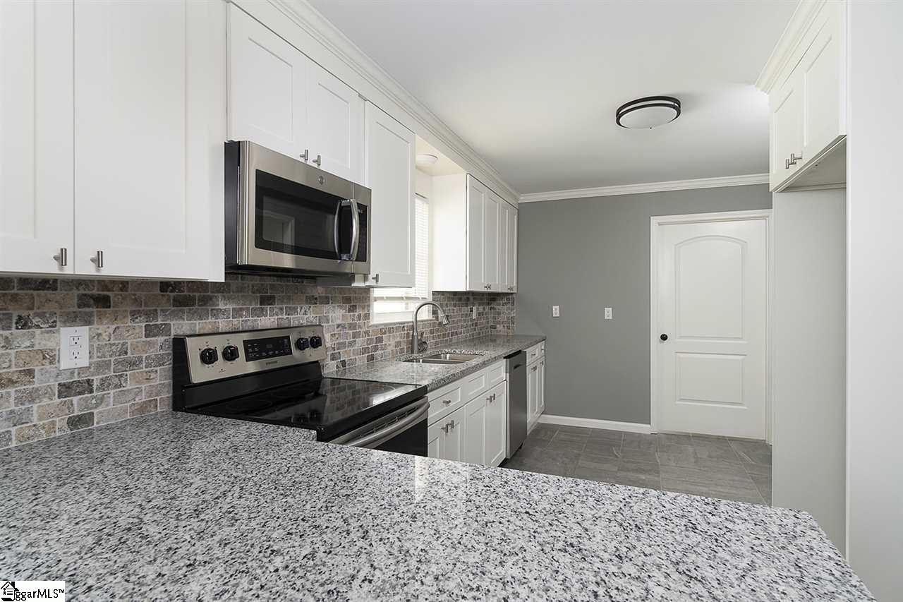 122 Botany Slopes Road Piedmont, SC 29673 - Photo 10 of 35 Granite Counter tops. Stone Backsplash