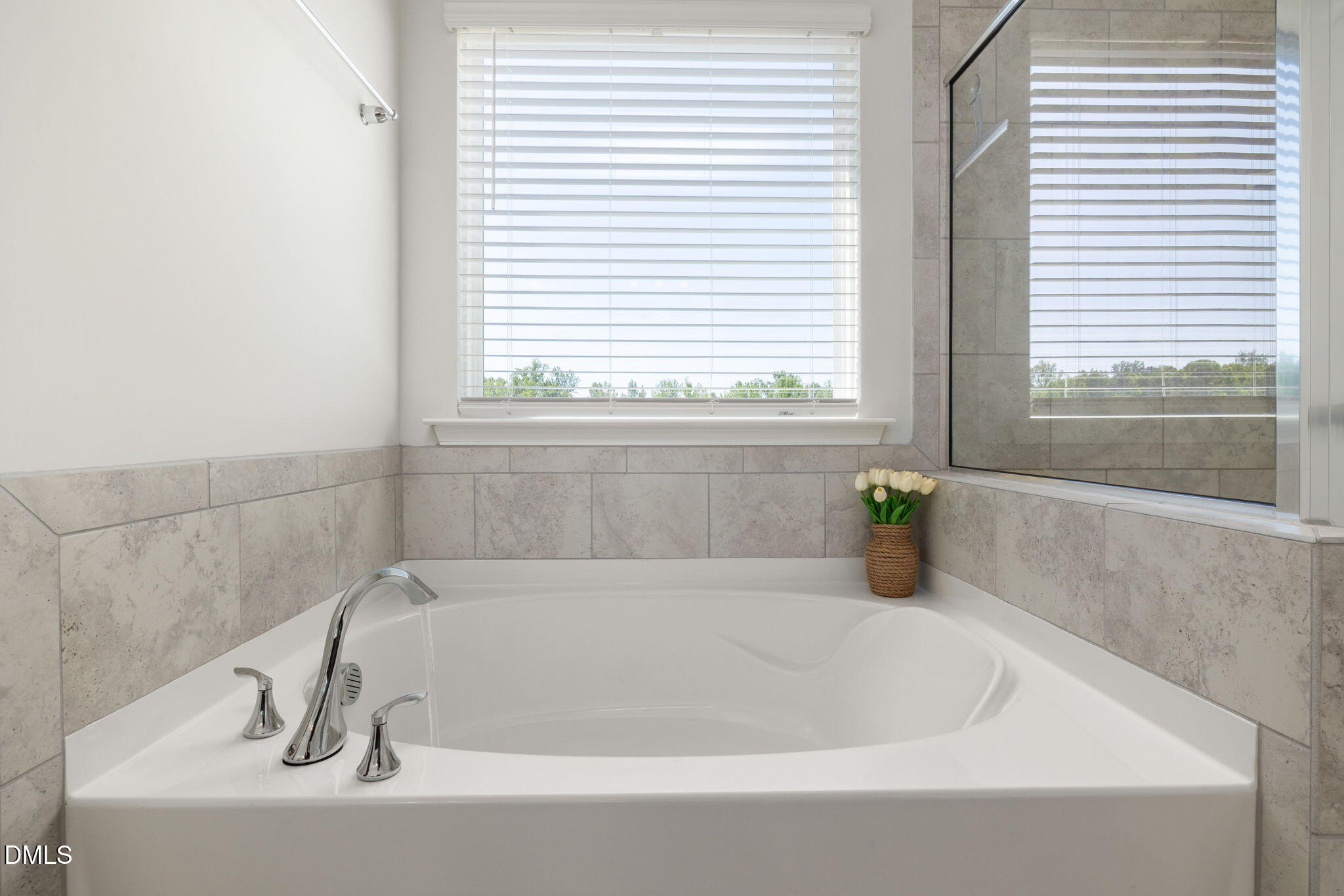3422 Longleaf Estates Drive Raleigh, NC 27616 - Photo 35 of 71 a white bath tub sitting in a bathroom next to a window