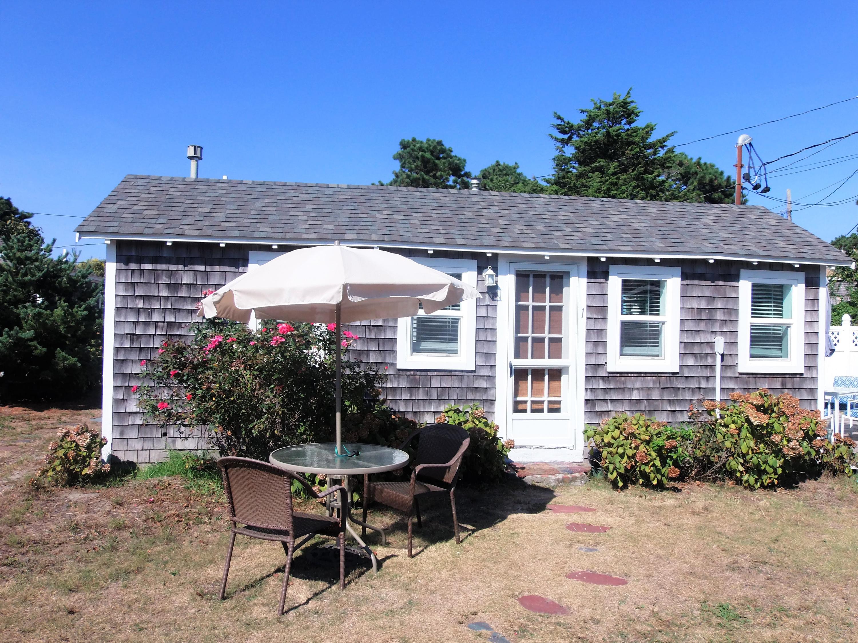 94 Old Wharf Road, Unit U1 Dennis Port, MA 02639 - Photo 1 of 10 a house view with a sitting space