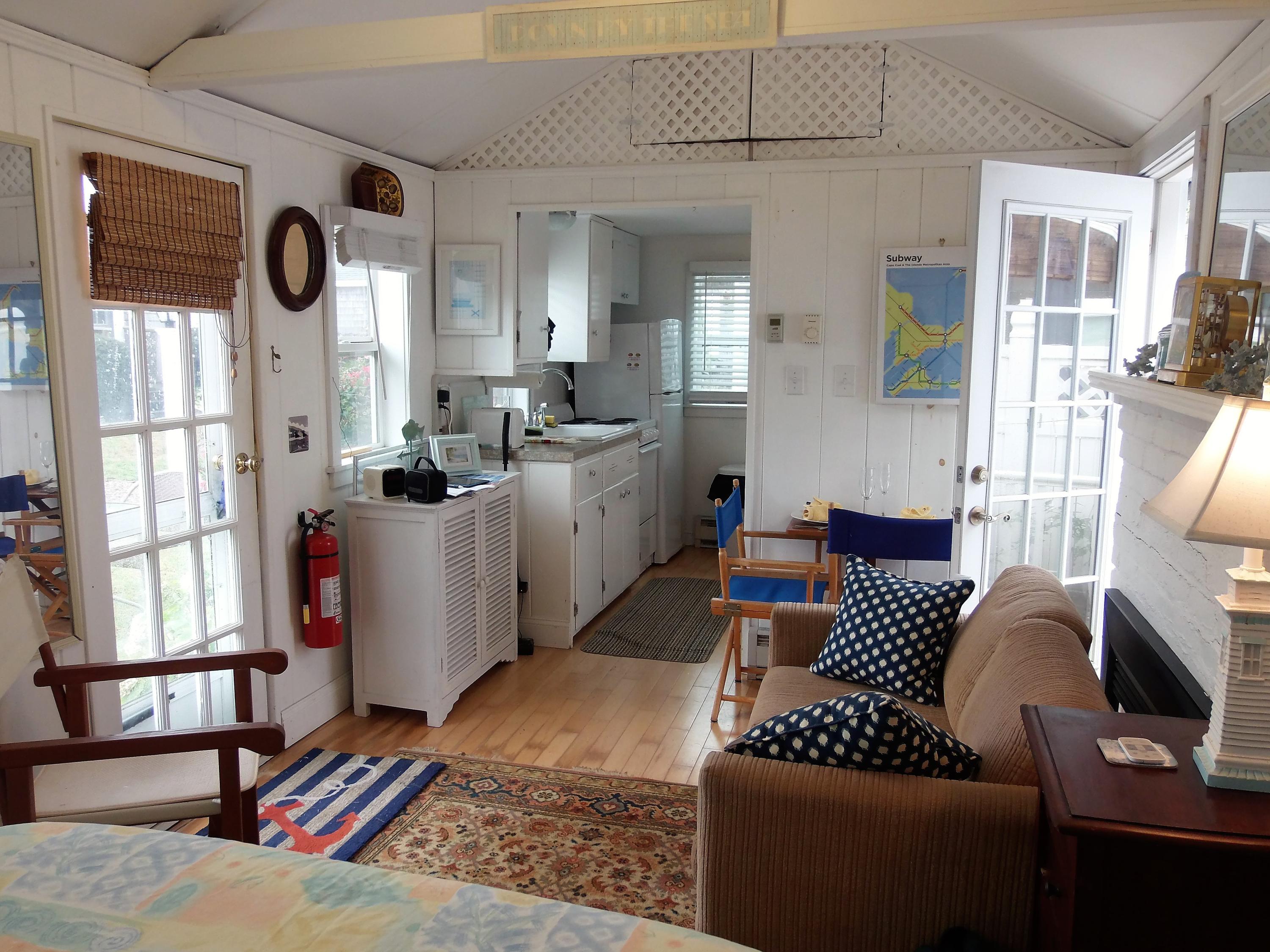 94 Old Wharf Road, Unit U1 Dennis Port, MA 02639 - Photo 2 of 10 a living room with furniture and a window