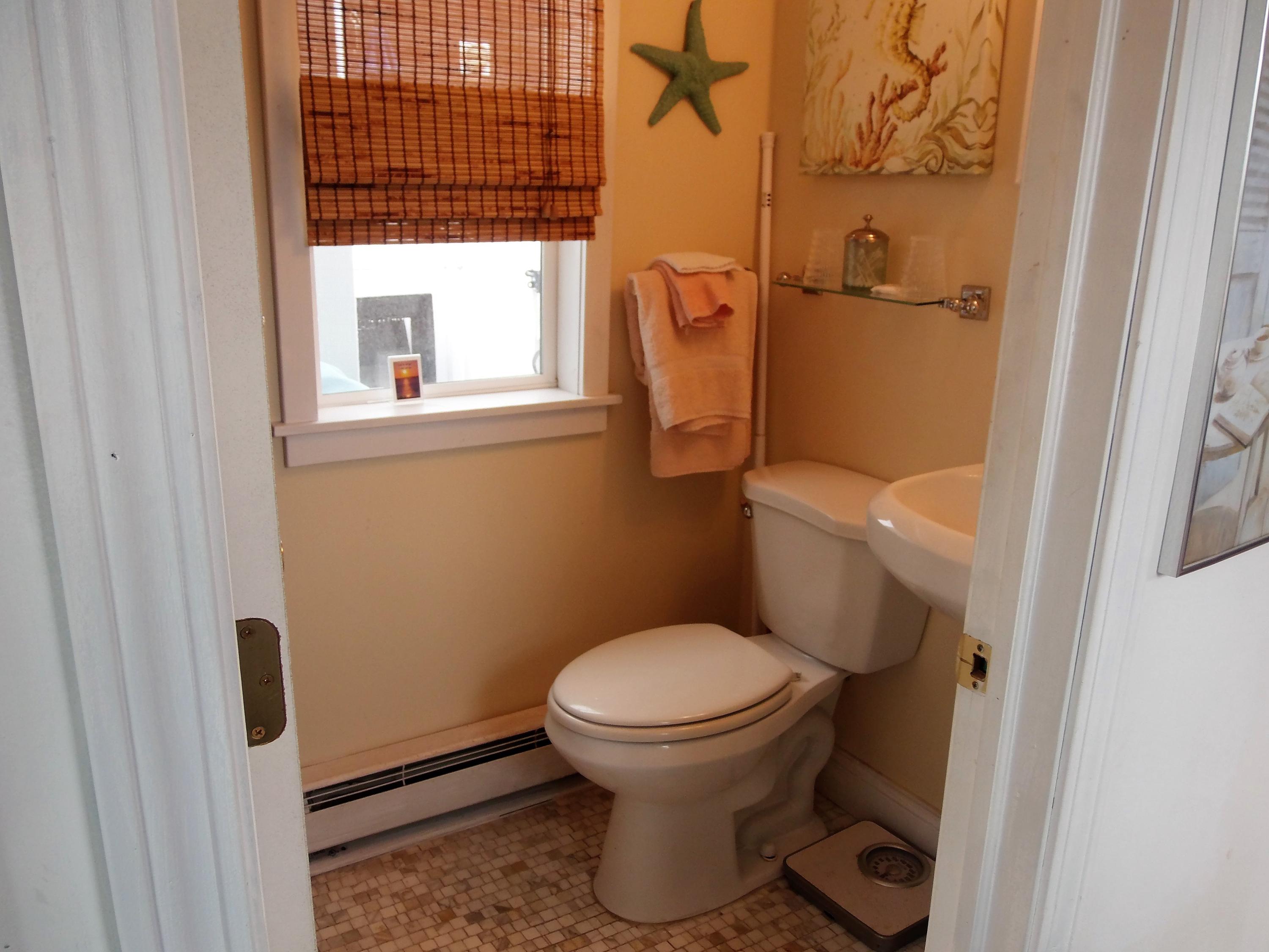 94 Old Wharf Road, Unit U1 Dennis Port, MA 02639 - Photo 4 of 10 a bathroom with a toilet and a sink