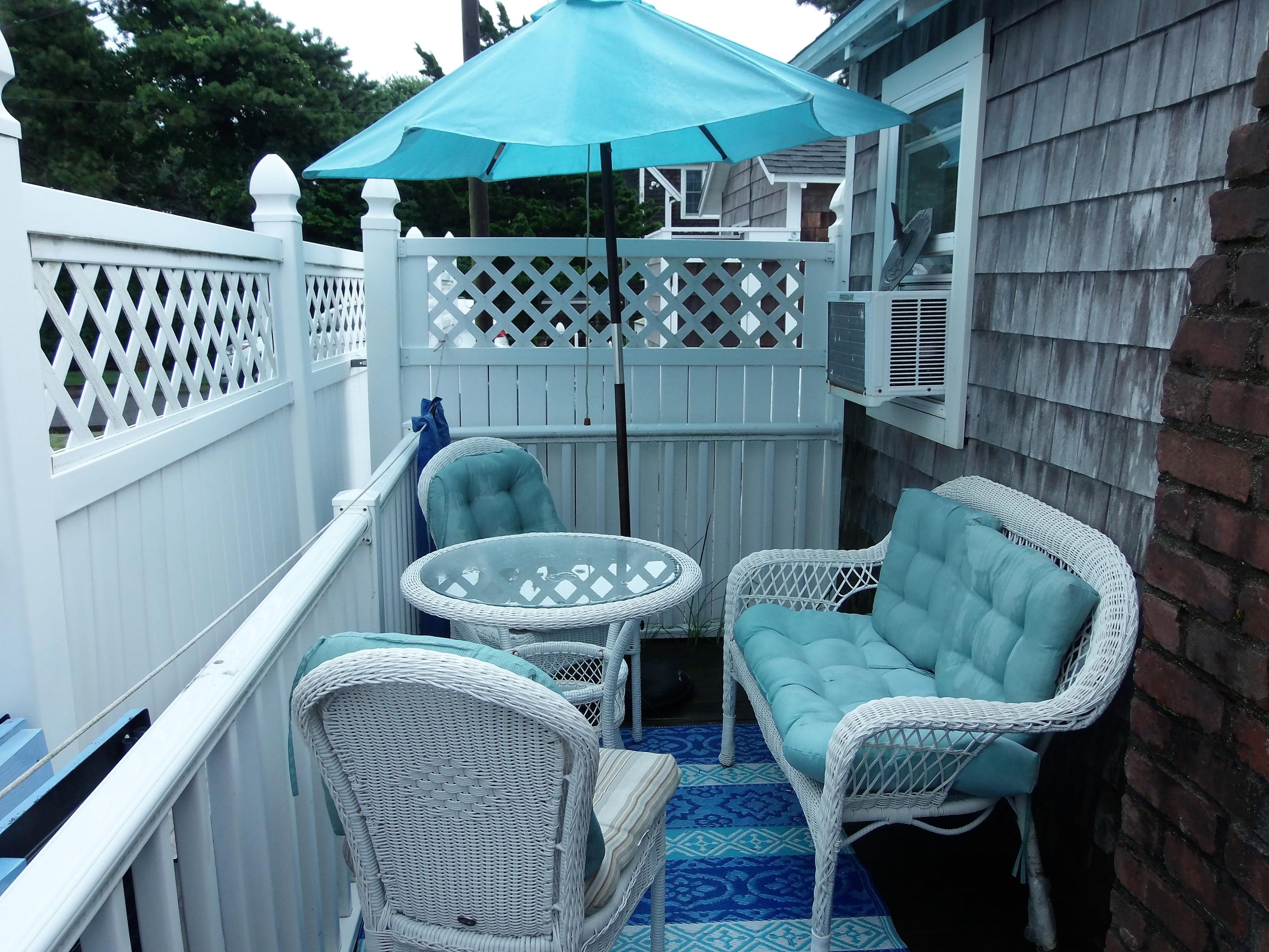 94 Old Wharf Road, Unit U1 Dennis Port, MA 02639 - Photo 5 of 10 a view of a patio in the backyard