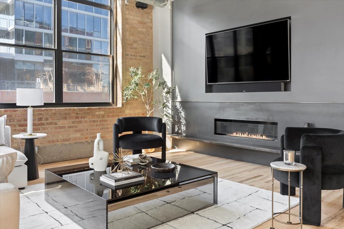 850 West Adams Street, Unit 4A Chicago, IL 60607 - Photo 11 of 52 a living room with furniture and a fireplace