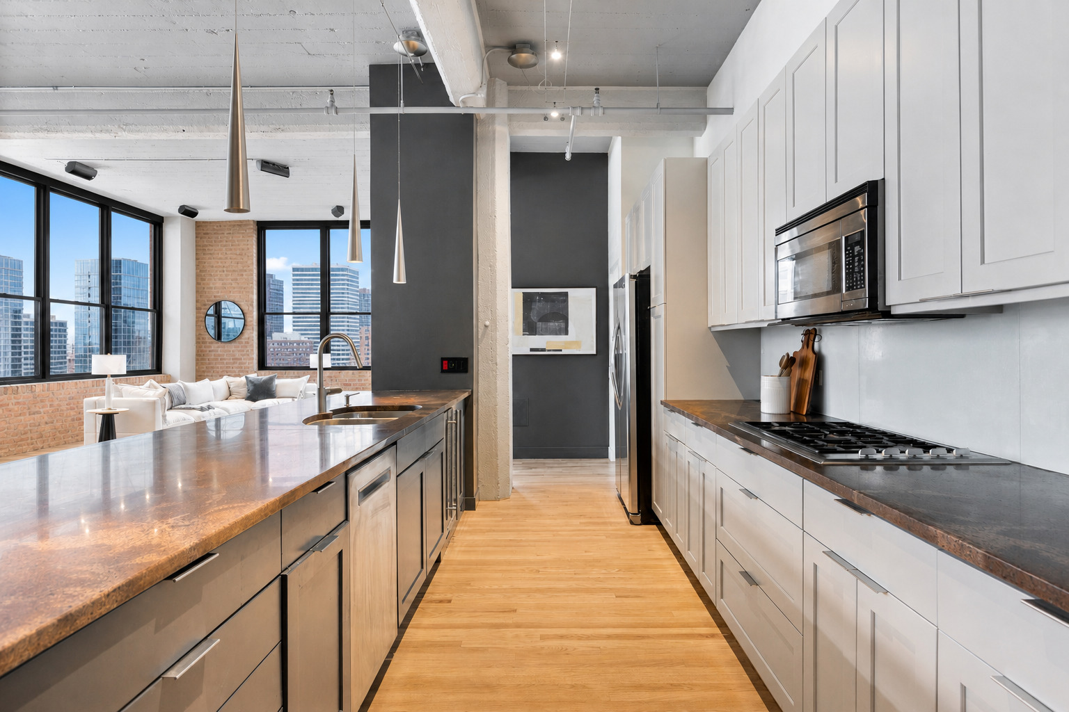 850 West Adams Street, Unit 4A Chicago, IL 60607 - Photo 23 of 52 a large kitchen with stainless steel appliances granite countertop a lot of counter space and a sink