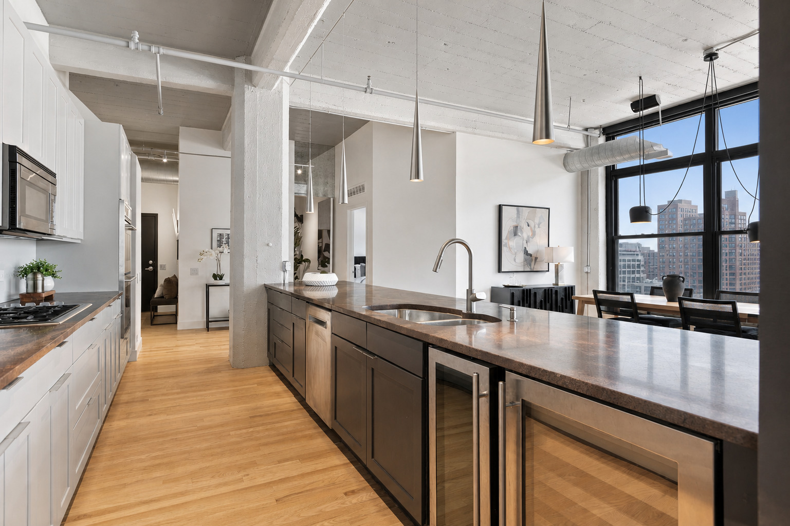 850 West Adams Street, Unit 4A Chicago, IL 60607 - Photo 24 of 52 a large kitchen with stainless steel appliances lots of counter space and window