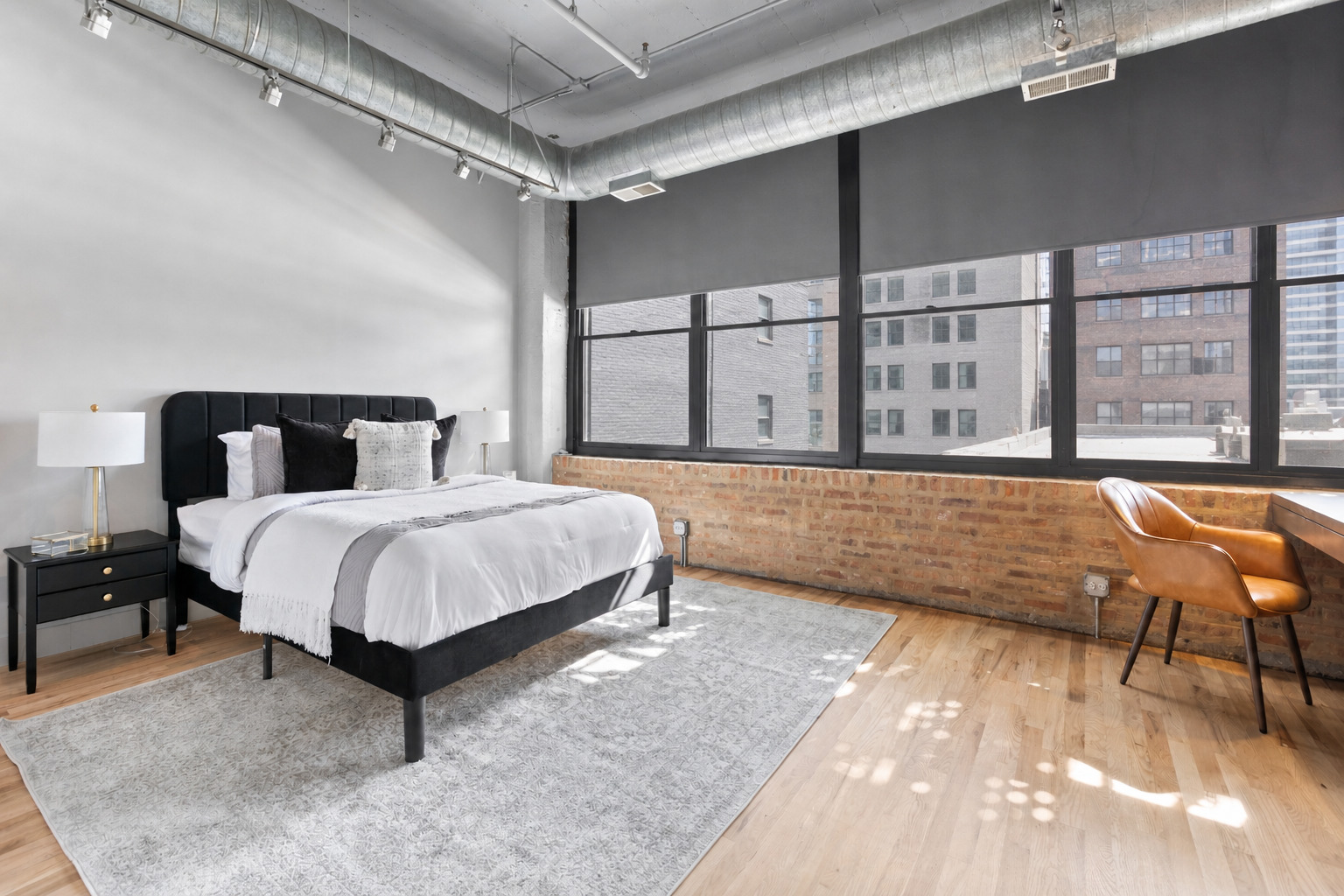 850 West Adams Street, Unit 4A Chicago, IL 60607 - Photo 42 of 52 a spacious bedroom with a bed and large window