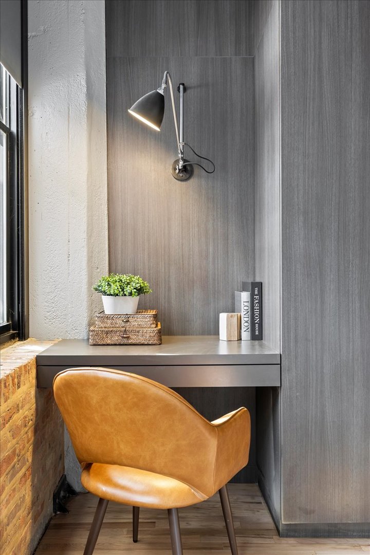 850 West Adams Street, Unit 4A Chicago, IL 60607 - Photo 45 of 52 a bathroom with a table and a chair