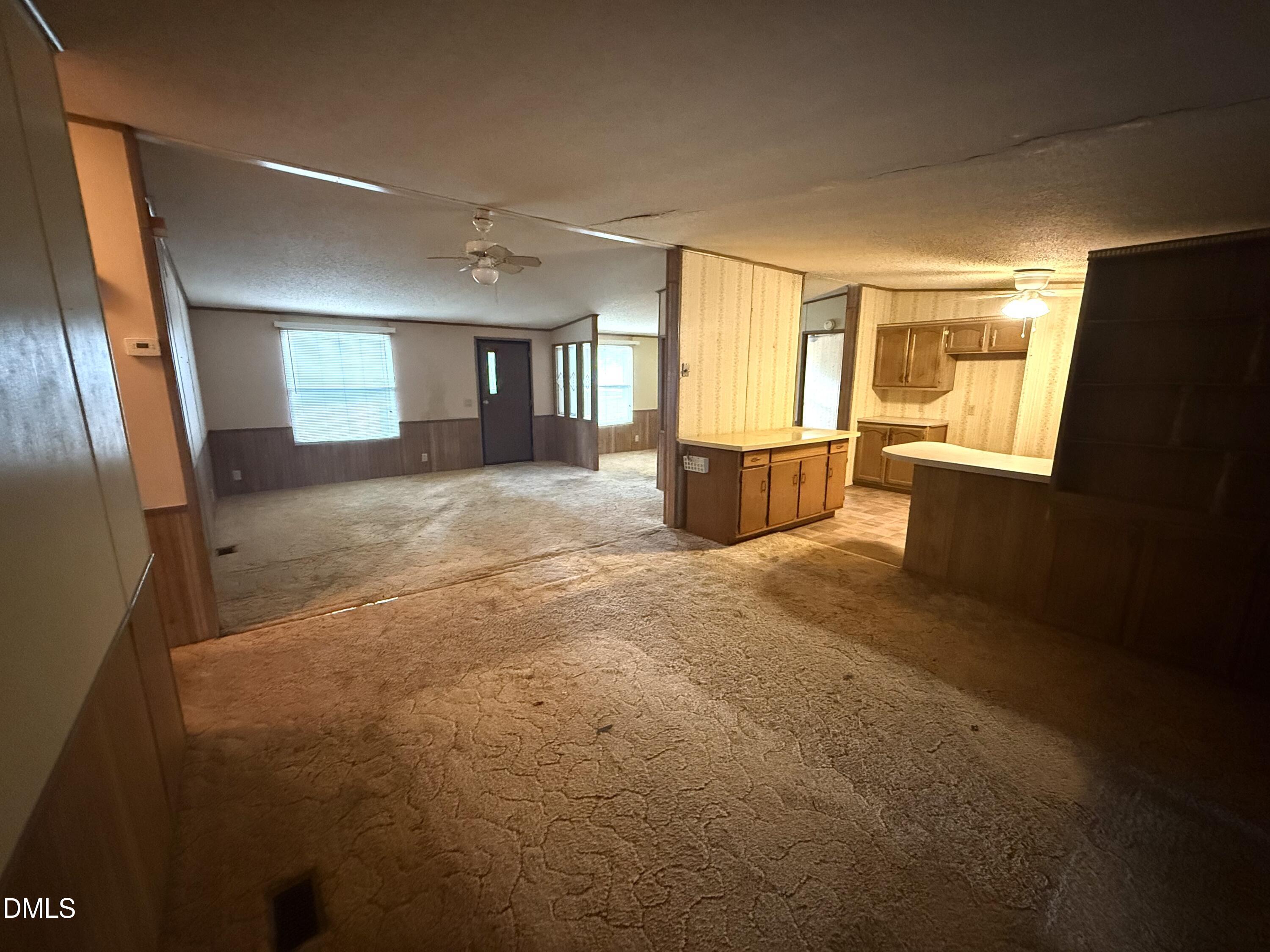 1969 Bagley Road Kenly, NC 27542 - Photo 14 of 23 a view of an empty room with a fireplace
