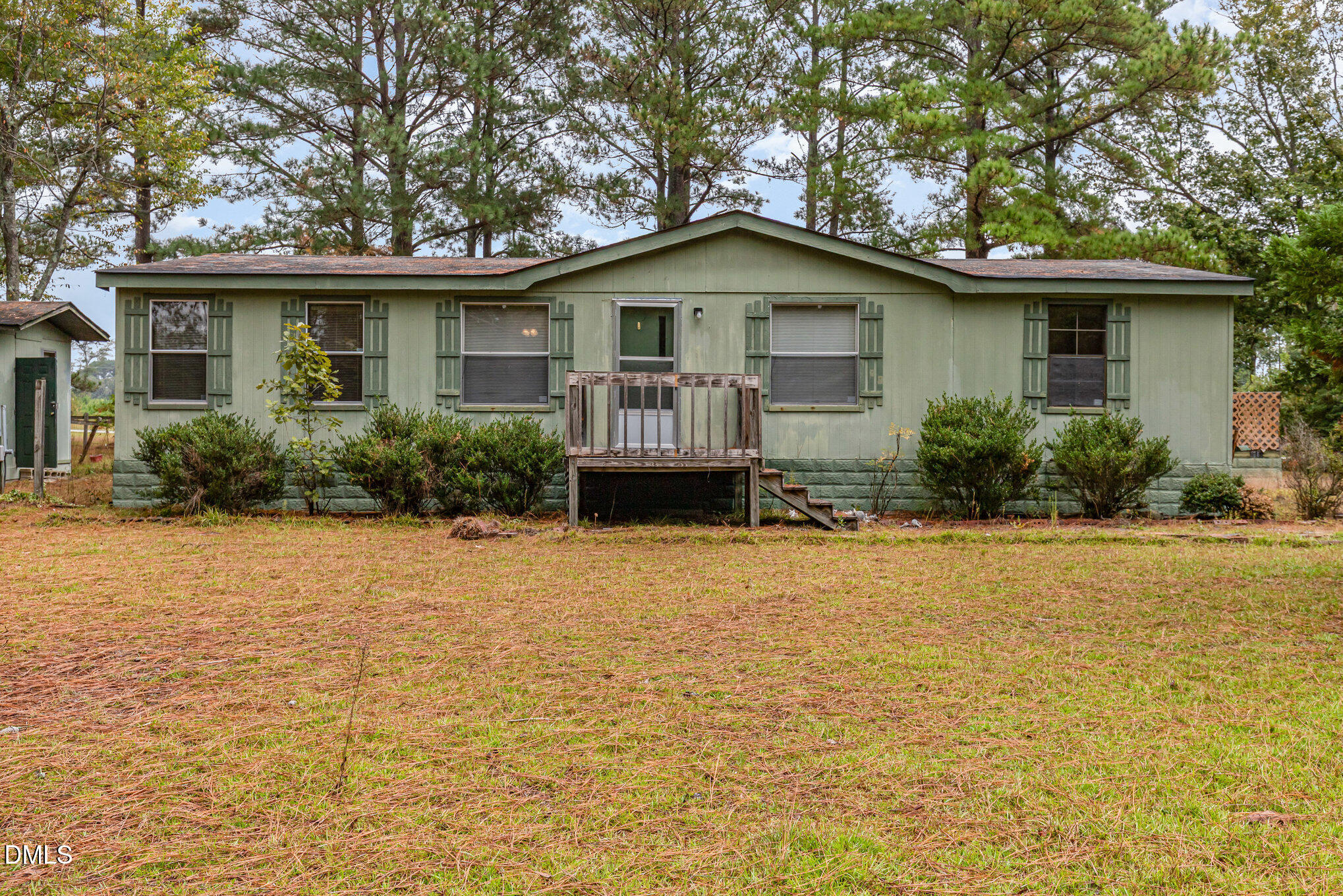 1969 Bagley Road Kenly, NC 27542 - Photo 2 of 23 a front view of house with yard and trees around