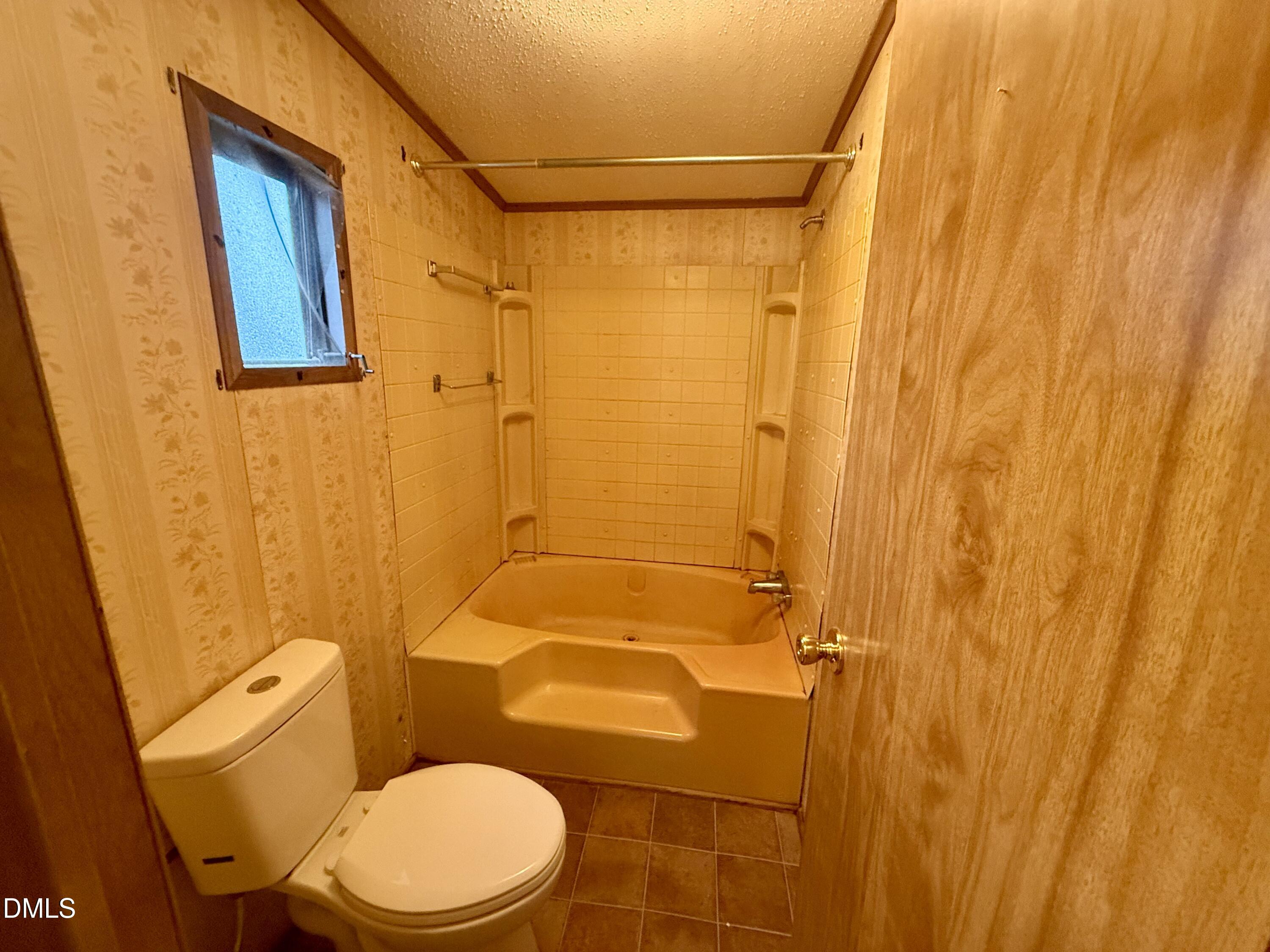 1969 Bagley Road Kenly, NC 27542 - Photo 23 of 23 a white toilet sitting next to a sink