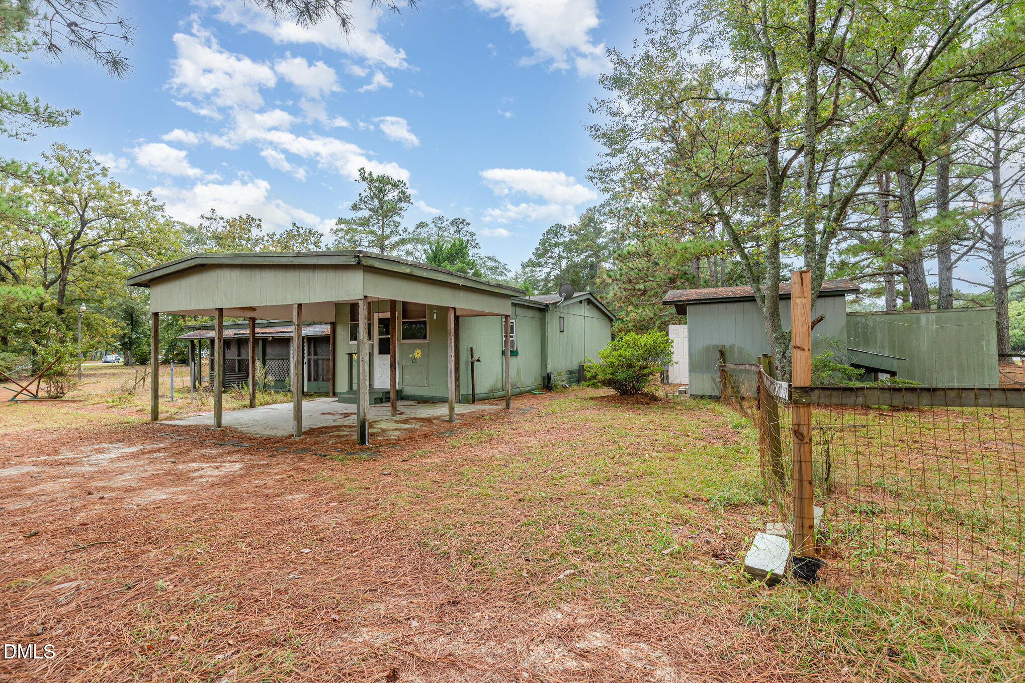 1969 Bagley Road Kenly, NC 27542 - Photo 7 of 23 a view of a house with backyard and a tree