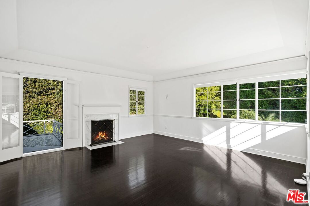 1910 Outpost Drive Los Angeles, CA 90068 - Photo 12 of 27 a view of an empty room with wooden floor and a window