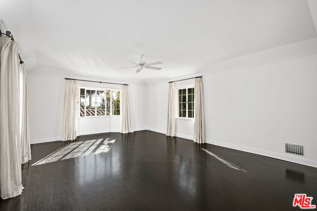 1910 Outpost Drive Los Angeles, CA 90068 - Photo 14 of 27 a view of an empty room with wooden floor and a window