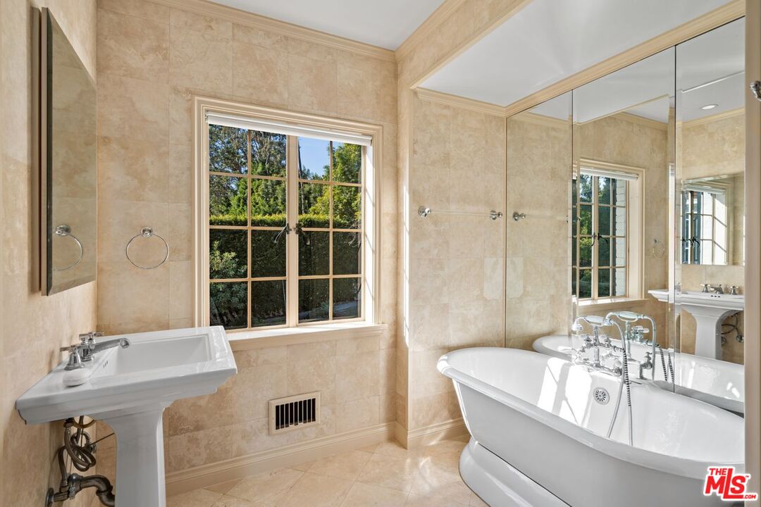 1910 Outpost Drive Los Angeles, CA 90068 - Photo 18 of 27 a bathroom with a tub sink and mirror