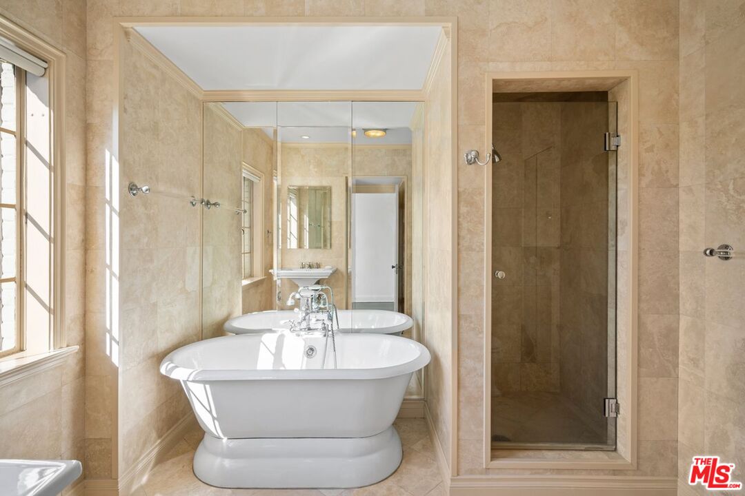 1910 Outpost Drive Los Angeles, CA 90068 - Photo 19 of 27 a bathroom with a bathtub and shower