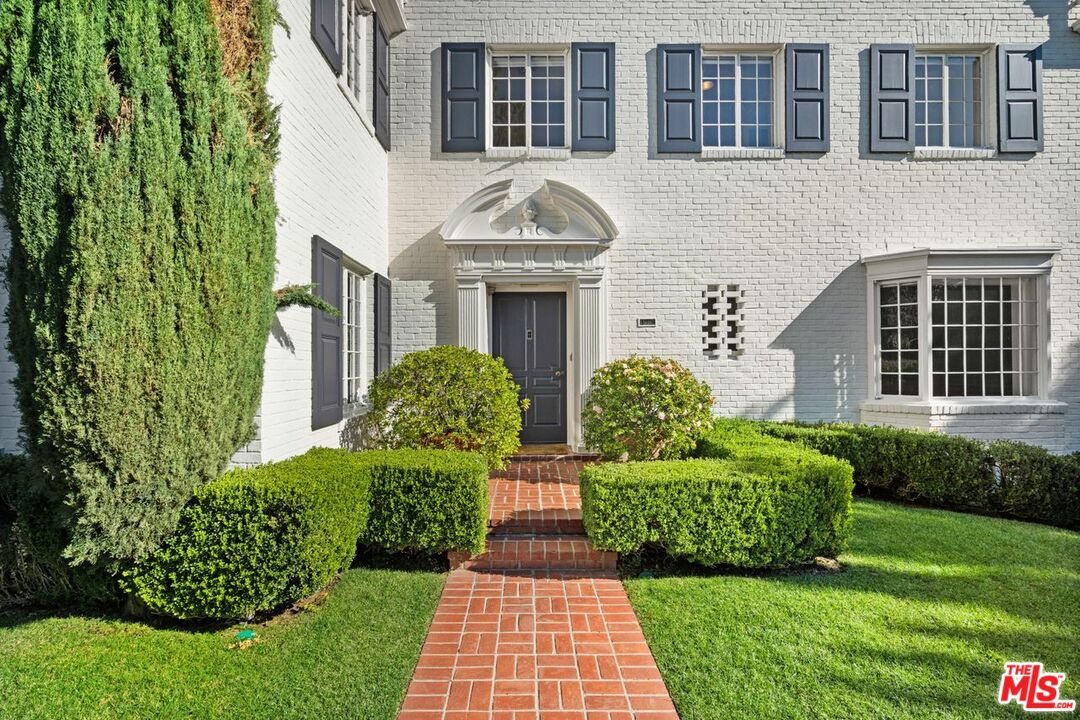 1910 Outpost Drive Los Angeles, CA 90068 - Photo 2 of 27 a front view of a house with garden