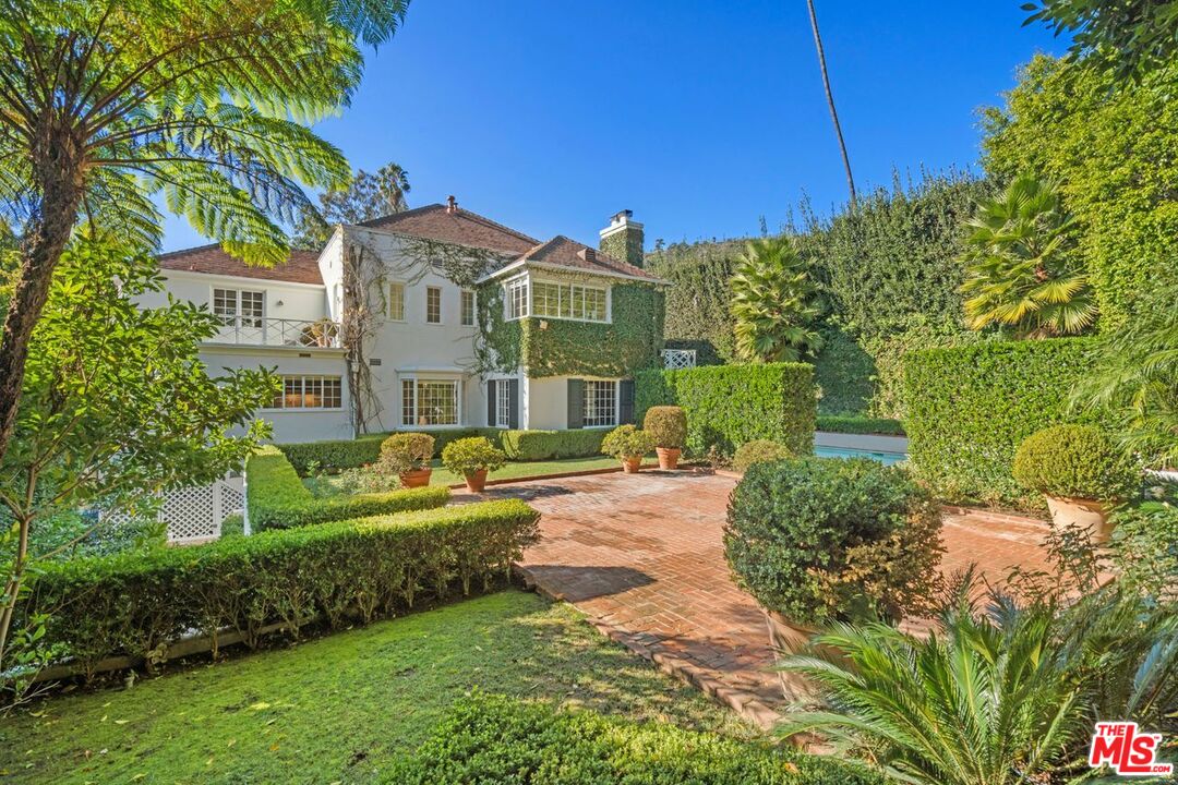 1910 Outpost Drive Los Angeles, CA 90068 - Photo 24 of 27 a front view of a house with a garden