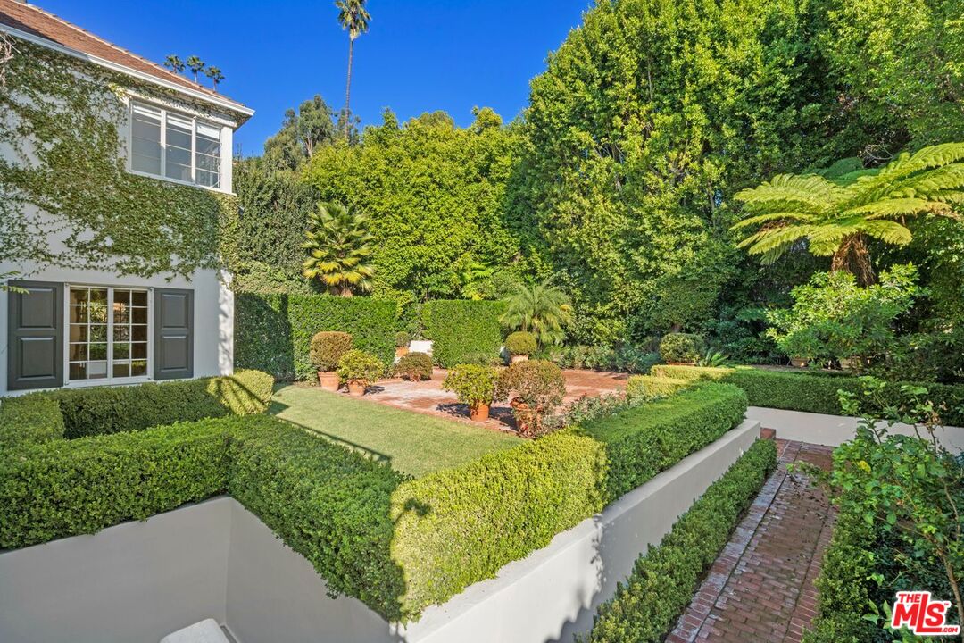 1910 Outpost Drive Los Angeles, CA 90068 - Photo 26 of 27 a view of a house with backyard sitting area and garden