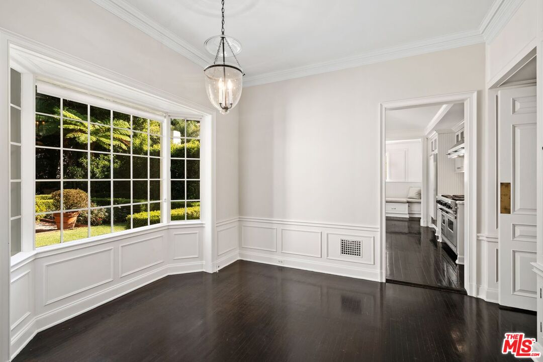 1910 Outpost Drive Los Angeles, CA 90068 - Photo 8 of 27 a view of an empty room with a window and wooden floor