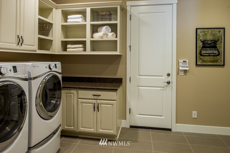 5633 196th Street Southeast, Unit 31 Bothell, WA 98012 - Photo 13 of 25 a utility room with dryer and washer