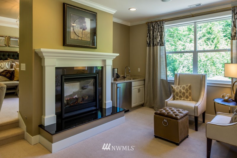 5633 196th Street Southeast, Unit 31 Bothell, WA 98012 - Photo 17 of 25 a living room with furniture and a fireplace
