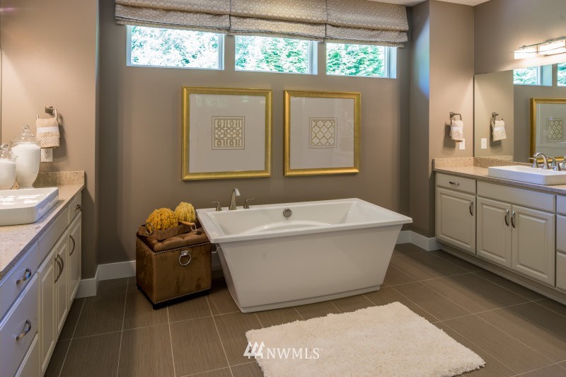 5633 196th Street Southeast, Unit 31 Bothell, WA 98012 - Photo 19 of 25 a bathroom with a tub sink and mirror