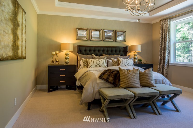 5633 196th Street Southeast, Unit 31 Bothell, WA 98012 - Photo 20 of 25 a bed sitting in a bedroom next to a window