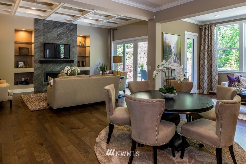 5633 196th Street Southeast, Unit 31 Bothell, WA 98012 - Photo 6 of 25 a living room with furniture a large window and a fireplace