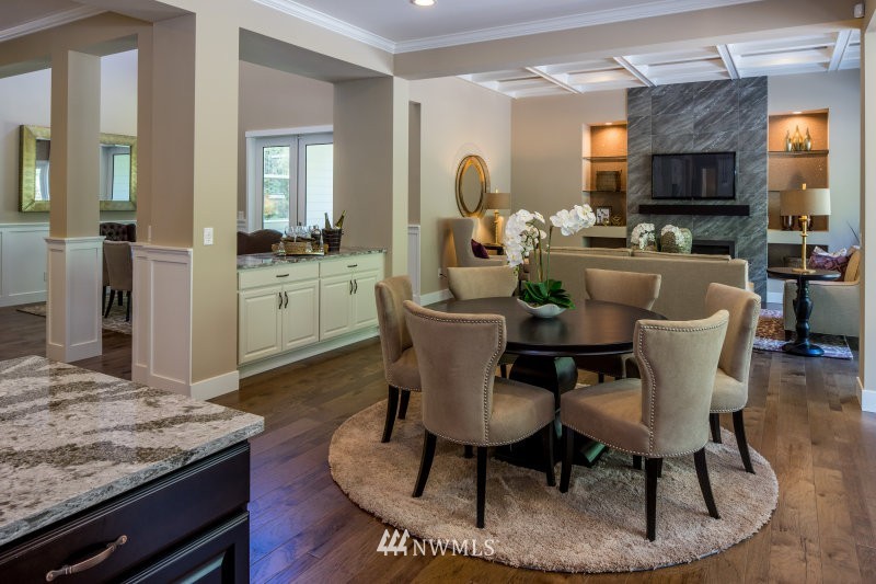 5633 196th Street Southeast, Unit 31 Bothell, WA 98012 - Photo 10 of 25 a dining room with furniture a rug and a kitchen view