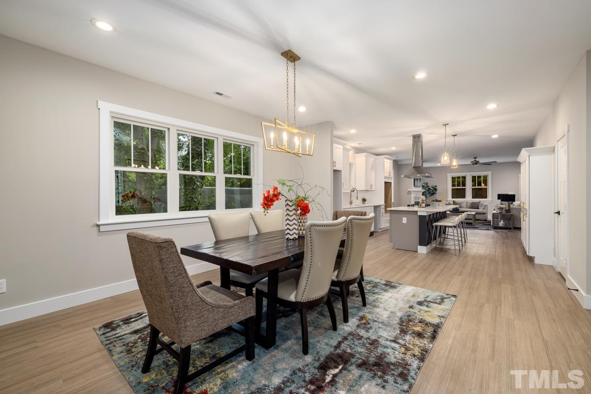 725 Church Street Raleigh, NC 27601 - Photo 7 of 21 a view of a dining room with furniture window and wooden floor